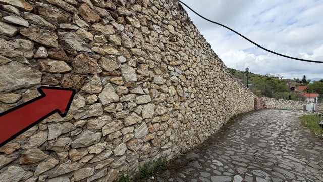 Hand-painted penguin stone #1155 hidden at Stone Wall, Macedonian Village, North Macedonia (photo 4 of 4)