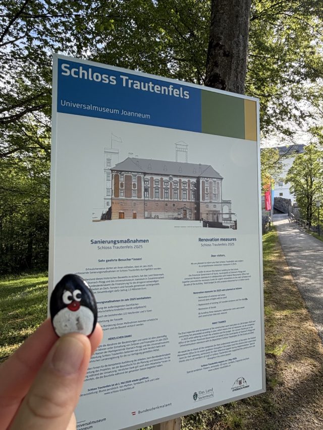 Hand-painted penguin stone #1300 hidden at Schloss Trautenfels, Purgg, Austria (photo 2 of 5)