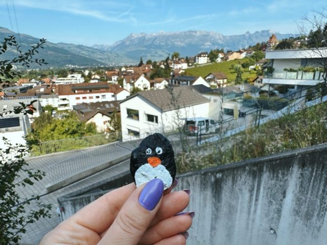 Hand-painted penguin stone #276 hidden at Way to the Castle, Vaduz, Liechtenstein (photo 2 of 3)
