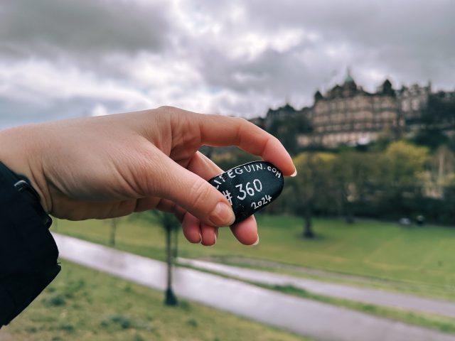 Hand-painted penguin stone #360 hidden at National Monument of Scotland, Edinburgh, United Kingdom (photo 3 of 4)