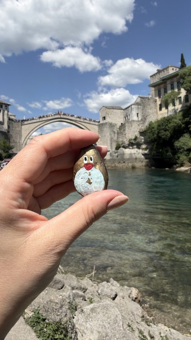 Hand-painted penguin stone #512 hidden at Mostar Old Bridge Photopoint, Mostar, Bosnia and Herzegovina (photo 2 of 5)
