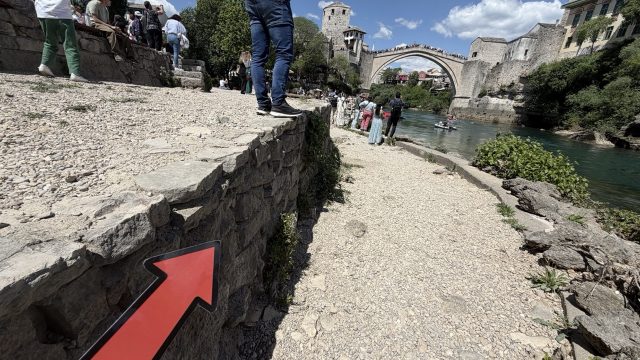 Hand-painted penguin stone #512 hidden at Mostar Old Bridge Photopoint, Mostar, Bosnia and Herzegovina (photo 5 of 5)