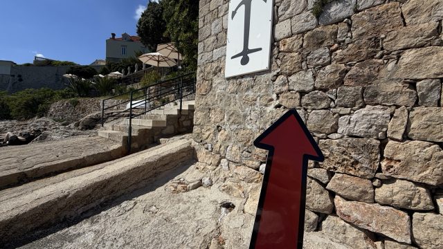 Hand-painted penguin stone #904 hidden at Port 22 Beach, Dubrovnik, Croatia (photo 4 of 5)
