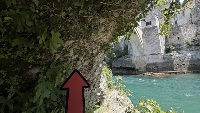 Hand-painted penguin stone #931 hidden at Old Bridge Mostar, Mostar, Bosnia and Herzegovina (photo 4 of 5)