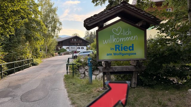 Hand-painted penguin stone #1265 hidden at Welcome in Ried Sign, St. Wolfgang im Salzkammergut, Austria (photo 3 of 5)