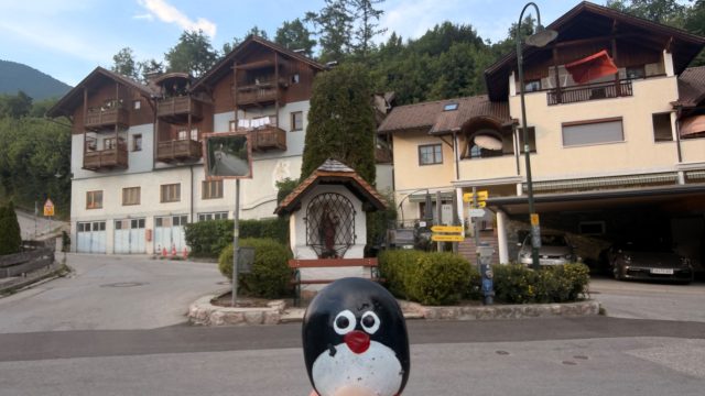 Hand-painted penguin stone #1267 hidden at Small Chapel with bench, St. Wolfgang im Salzkammergut, Austria