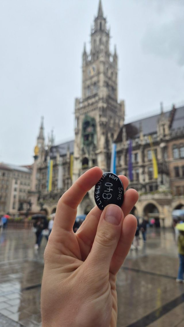 Hand-painted penguin stone #840 hidden at Marienplatz, Munich, Germany (photo 2 of 5)