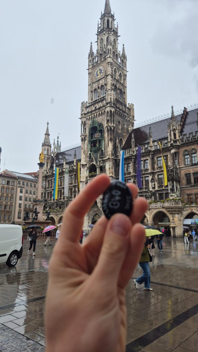 Hand-painted penguin stone #840 hidden at Marienplatz, Munich, Germany (photo 3 of 5)
