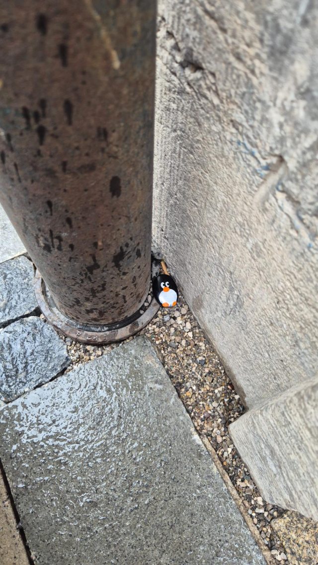 Hand-painted penguin stone #840 hidden at Marienplatz, Munich, Germany (photo 4 of 5)