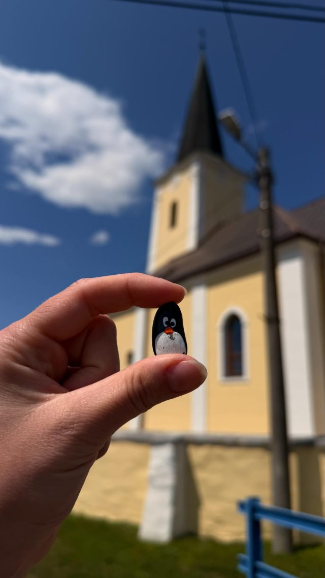 Hand-painted penguin stone #1106 hidden at Church of Saints Simon and Jude, Tulcik, Slovakia (photo 2 of 5)