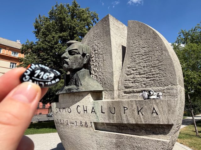 Hand-painted penguin stone #1168 hidden at Statue of Samo Chalupka, Bratislava, Slovakia (photo 2 of 4)