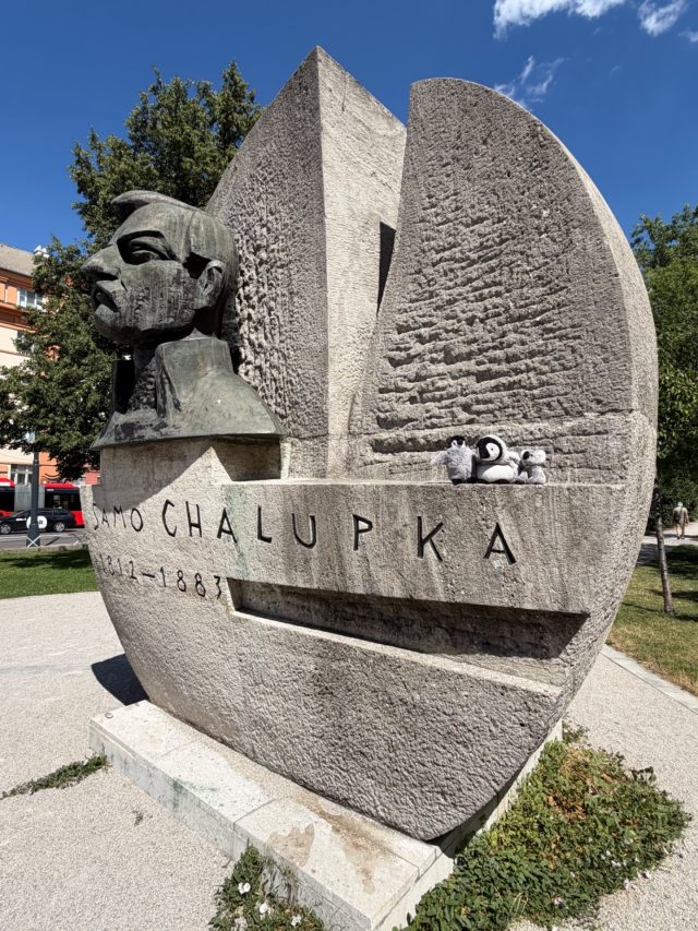 Hand-painted penguin stone #1168 hidden at Statue of Samo Chalupka, Bratislava, Slovakia (photo 3 of 4)