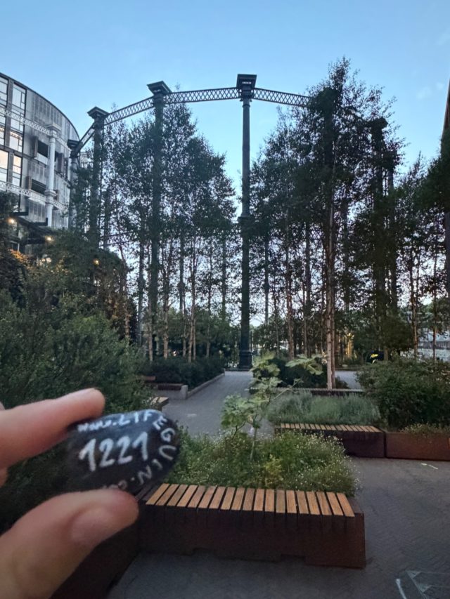Hand-painted penguin stone #1221 hidden at Gasholder Park, London, United Kingdom (photo 2 of 5)