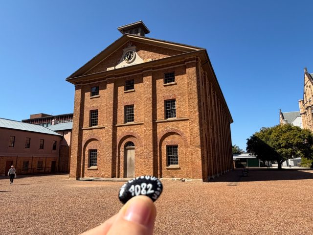 Hand-painted penguin stone #1082 hidden at Hyde Park Barracks, Sydney, Australia (photo 2 of 5)