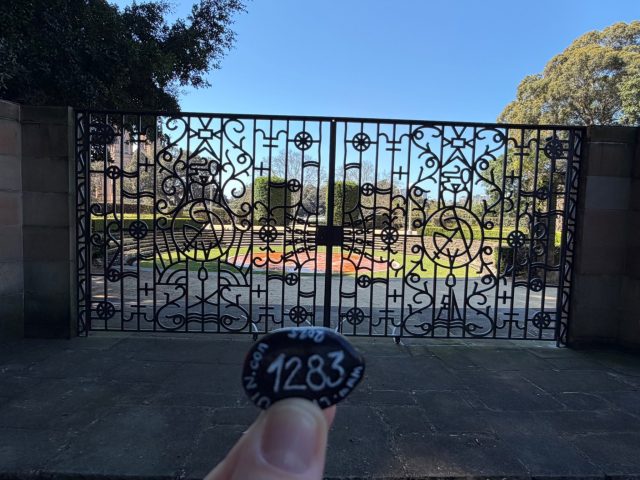 Hand-painted penguin stone #1283 hidden at Sandringham Memorial Gates, Sydney, Australia (photo 2 of 4)