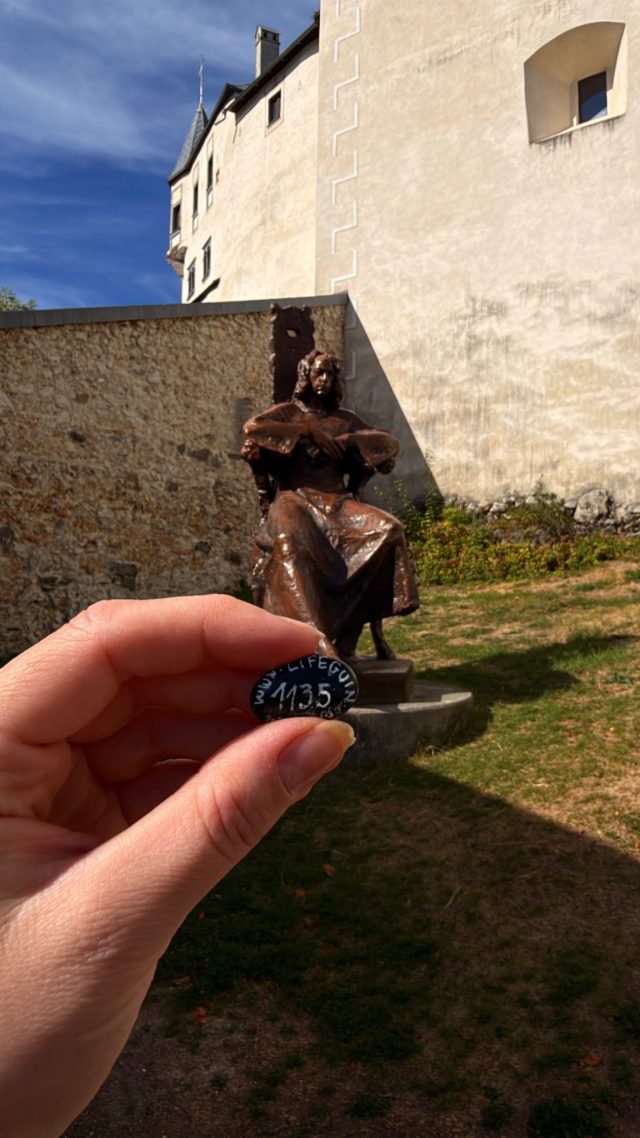 Hand-painted penguin stone #1135 hidden at Mathias Bel Statue at Lupca Castle, Slovenska Lupca, Slovakia (photo 2 of 5)