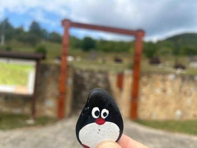 Hand-painted penguin stone #1304 hidden at Ladomirova Mini Wooden Church, Lutina, Slovakia