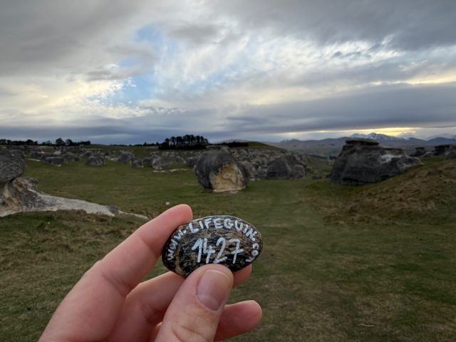 Hand-painted penguin stone #1427 hidden at Elephant Rocks, Island Cliff, New Zealand (photo 3 of 5)