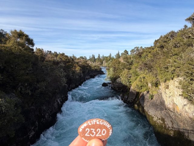 Hand-painted penguin stone #2320 hidden at Huka Falls, Taipo, New Zealand (photo 2 of 5)