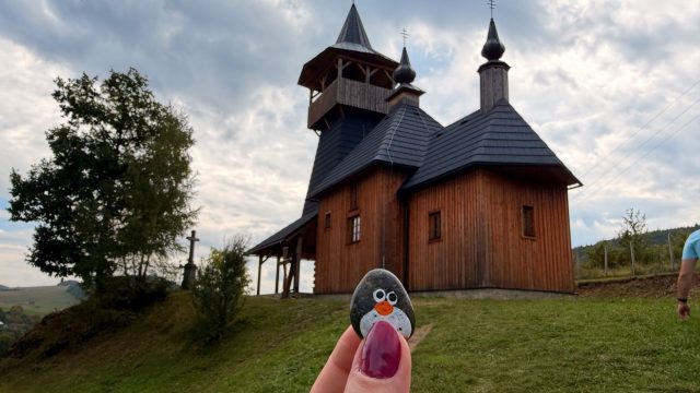 Hand-painted penguin stone #785 hidden at Church of the Holy Family, Lutina, Slovakia