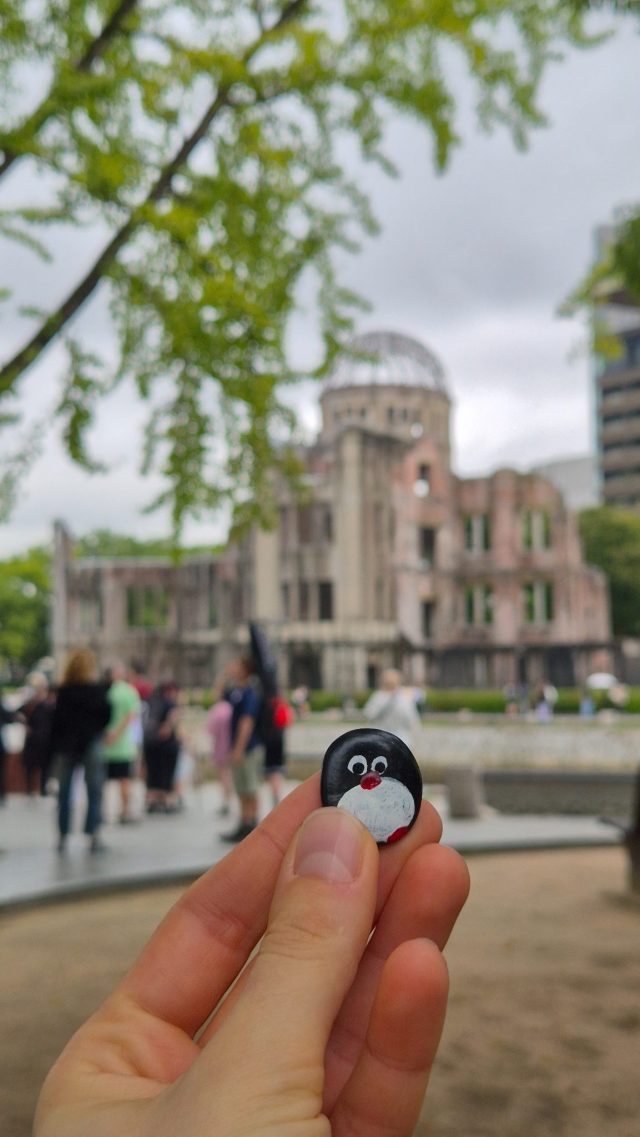 Hand-painted penguin stone #874 hidden at Tree Trunk, Hiroshima, Japan