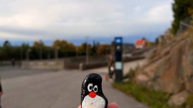 Hand-painted penguin stone #1351 hidden at Holmenkollen Metro Station, Oslo, Norway