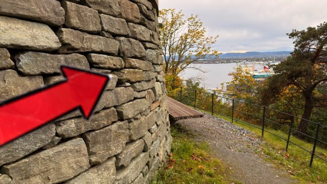 Hand-painted penguin stone #1388 hidden at Ekeberg Scenic Viewpoint, Oslo, Norway (photo 2 of 5)