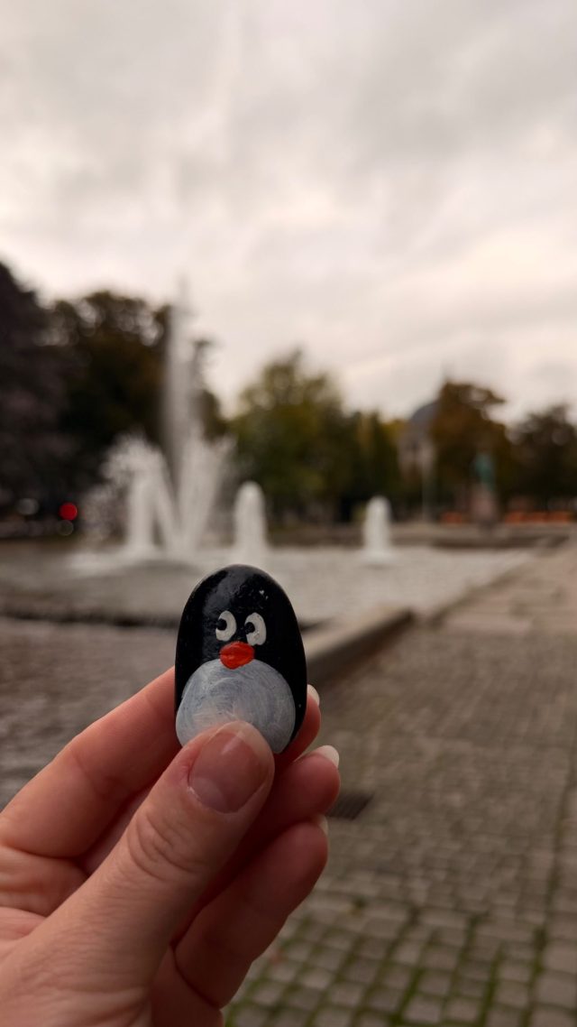 Hand-painted penguin stone #1472 hidden at Rainbow Square Tree Hole, Oslo, Norway (photo 4 of 5)