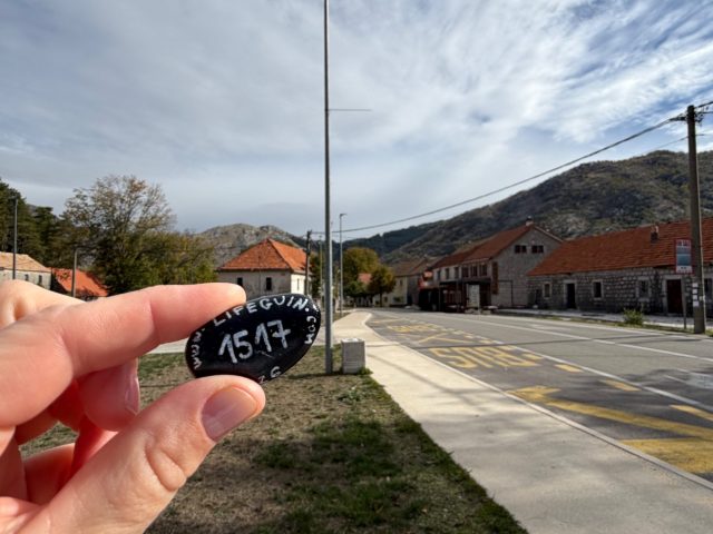 Hand-painted penguin stone #1517 hidden at Pomnik Ofiar Wojny 1941-1945, Njegusi, Montenegro (photo 2 of 4)