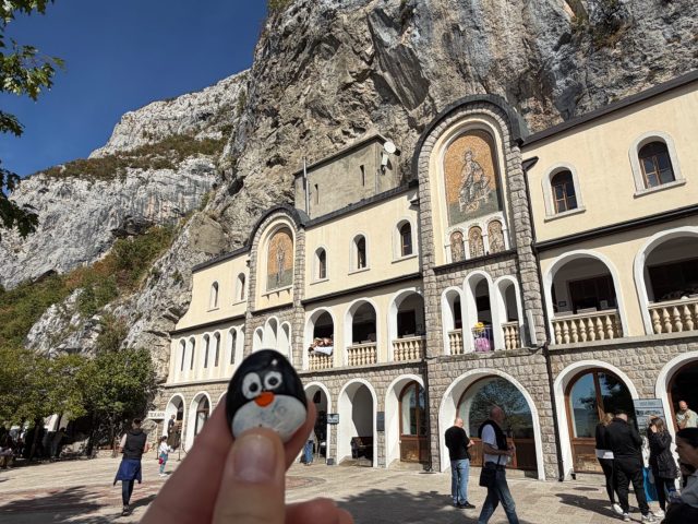 Hand-painted penguin stone #1518 hidden at Upper Ostrog Monastery, Bjelopavlici Plain, Montenegro (photo 2 of 5)