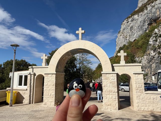 Hand-painted penguin stone #1518 hidden at Upper Ostrog Monastery, Bjelopavlici Plain, Montenegro (photo 3 of 5)