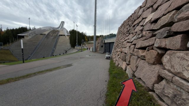 Hand-painted penguin stone #1557 hidden at Holmenkollbakken, Oslo, Norway (photo 2 of 5)
