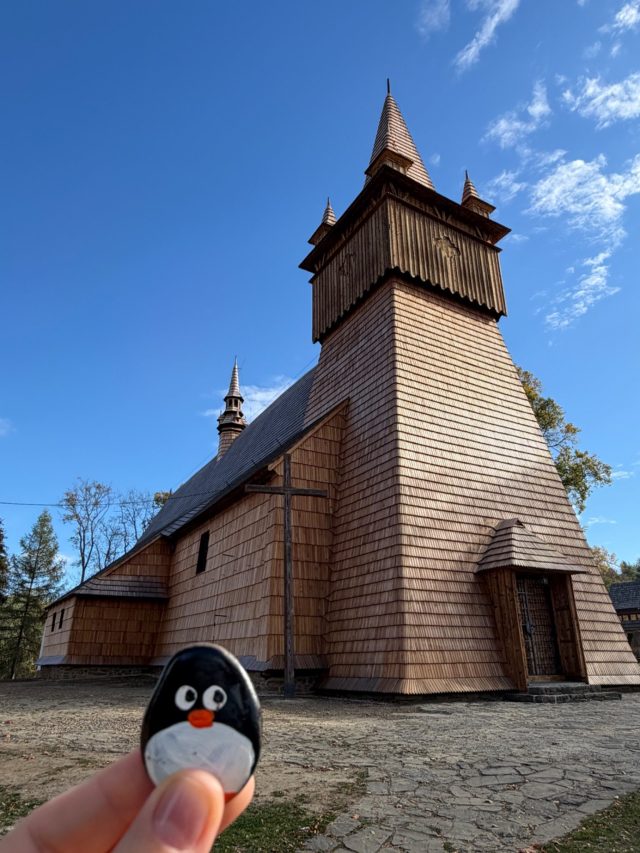 Hand-painted penguin stone #1566 hidden at Kosciol sw. Jana Chrzciciela w Orawce, Orawka, Poland