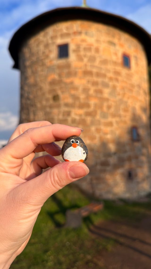 Hand-painted penguin stone #1894 hidden at Akershus Fortress Tower, Oslo, Norway (photo 2 of 5)