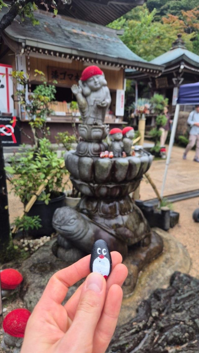 Hand-painted penguin stone #877 hidden at Gokurakukannon, Miyajima, Japan