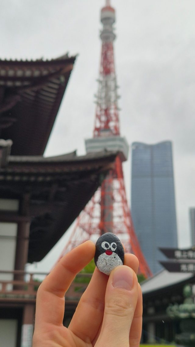 Hand-painted penguin stone #881 hidden at Zojo-ji Temple, Tokyo, Japan