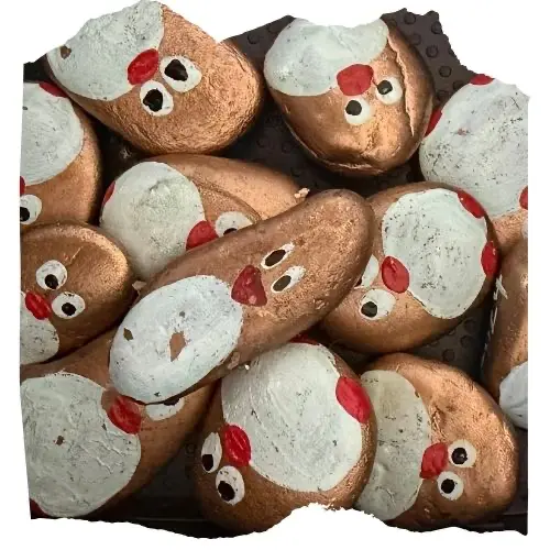 A box of rare golden hand-painted penguin stones