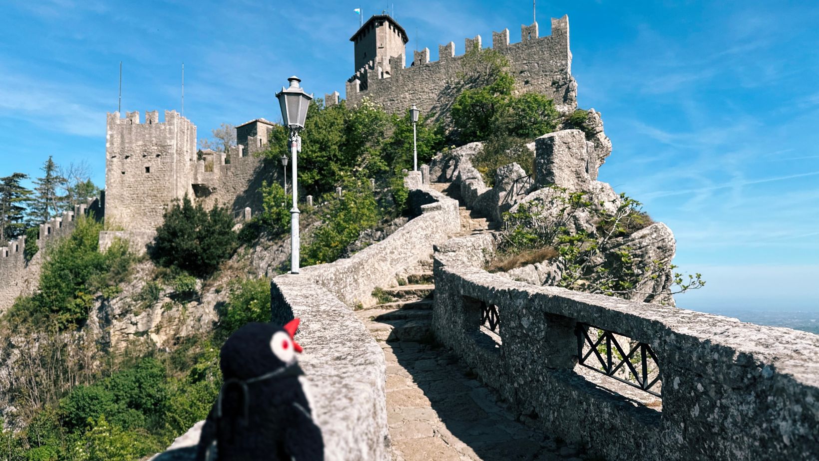 Hand-painted penguin stone #295 hidden at Guaita Fortress, San Marino, San Marino (photo 1 of 5)