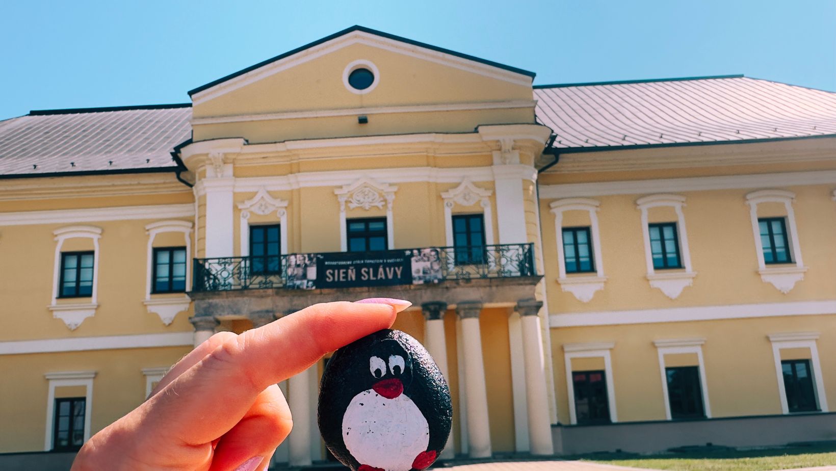 Hand-painted penguin stone #169 hidden at Manor House Snina, Snina, Slovakia (photo 1 of 5)