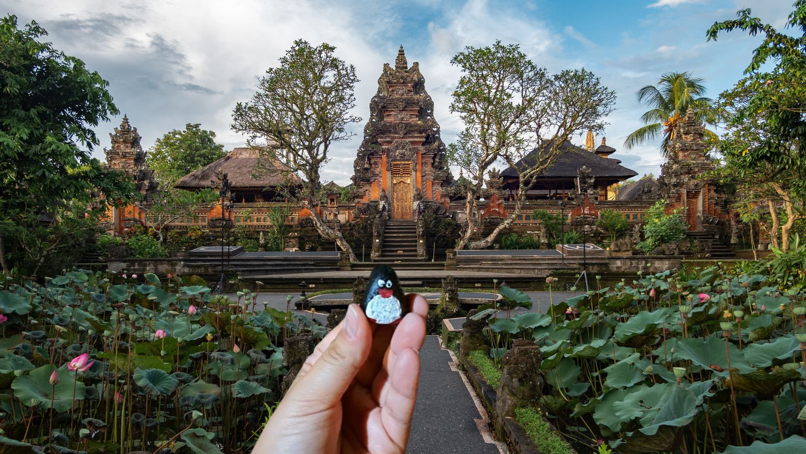 Hand-painted penguin stone #162 hidden at Pura Taman Kemuda Saraswati, Ubud, Indonesia (photo 1 of 5)
