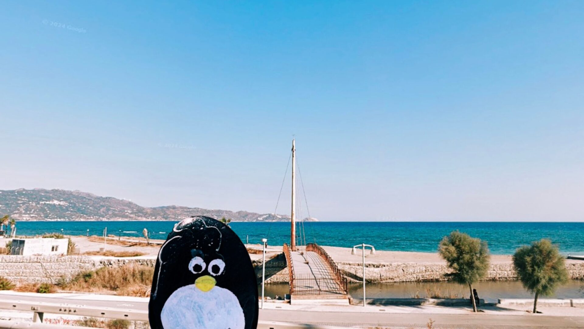 Hand-painted penguin stone #103 hidden at Old Bridge, Heraklion, Greece (photo 1 of 5)