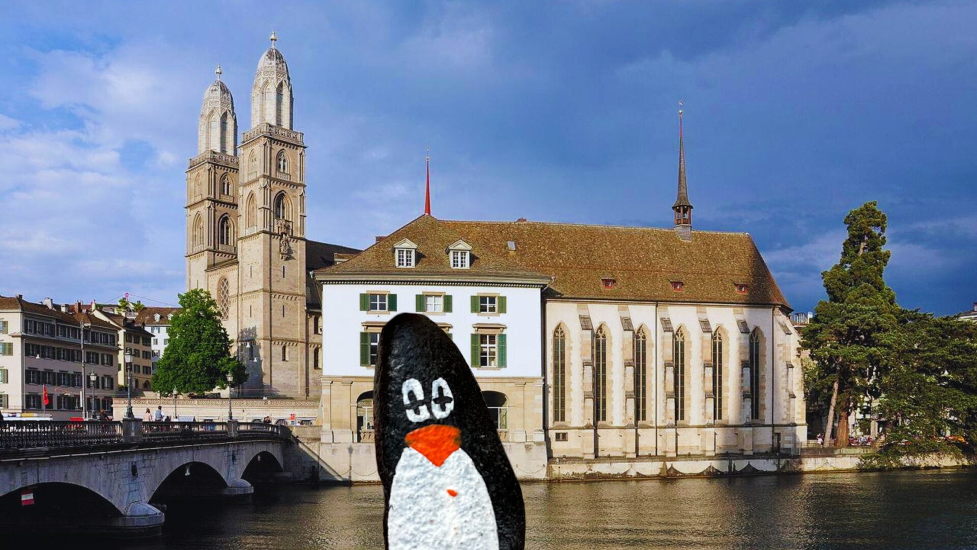 Hand-painted penguin stone #243 hidden at Wasserkirche, Zurich, Switzerland (photo 1 of 5)