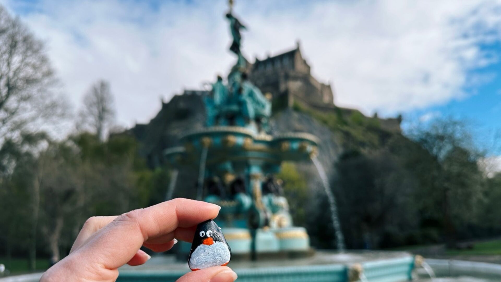 Hand-painted penguin stone #359 hidden at Ross Fountain, Edinburgh, United Kingdom (photo 1 of 5)