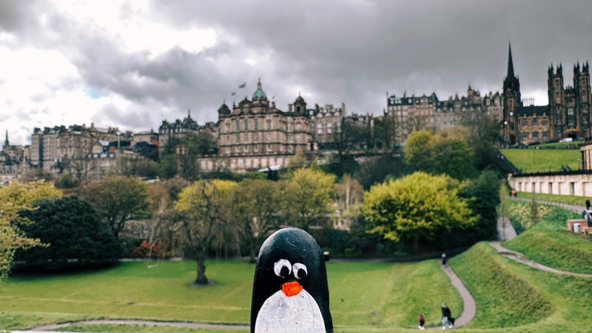 Hand-painted penguin stone #360 hidden at National Monument of Scotland, Edinburgh, United Kingdom (photo 1 of 4)