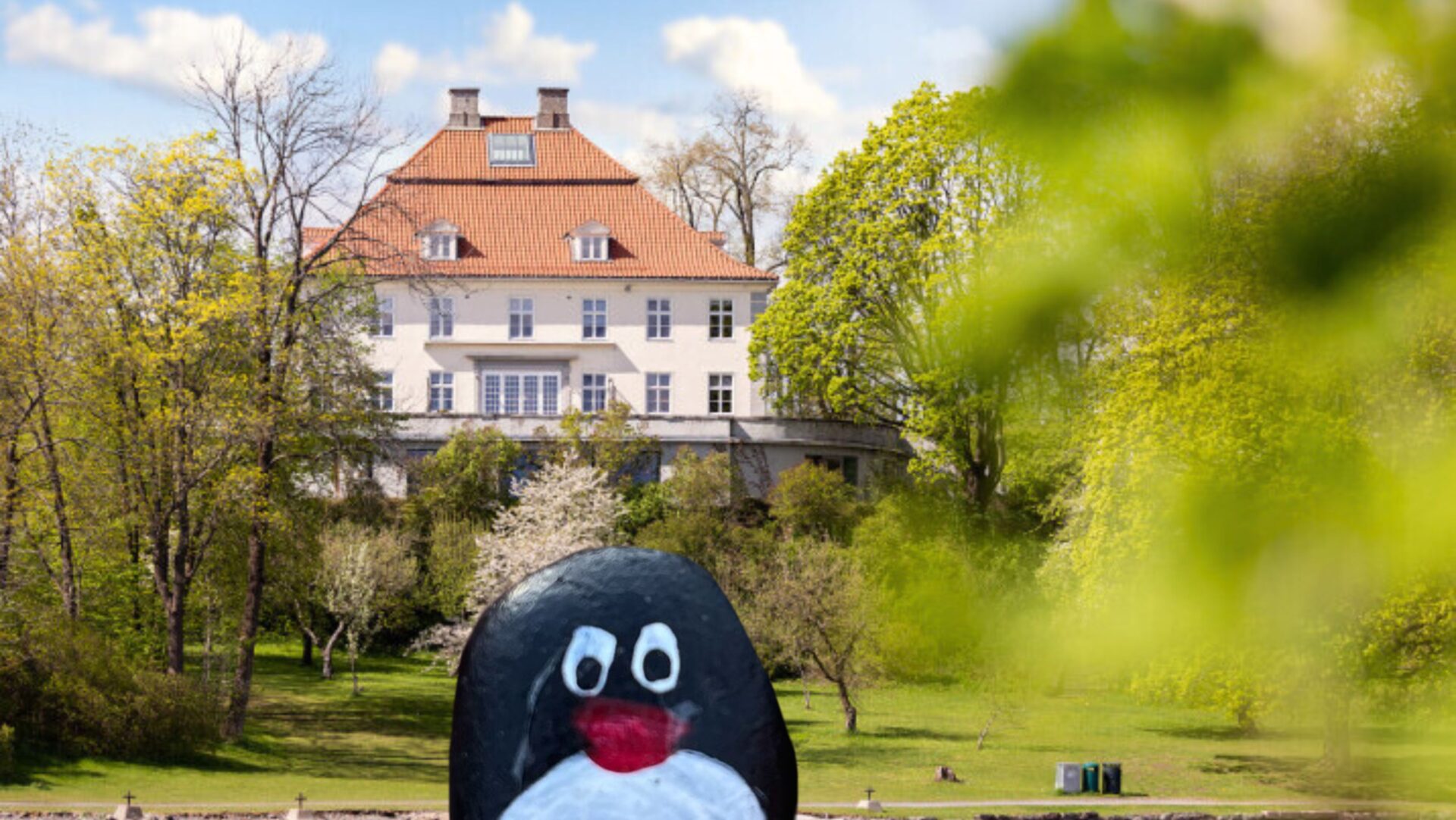 Hand-painted penguin stone #426 hidden at Fornebu Hovedgard, Oslo, Norway (photo 1 of 4)