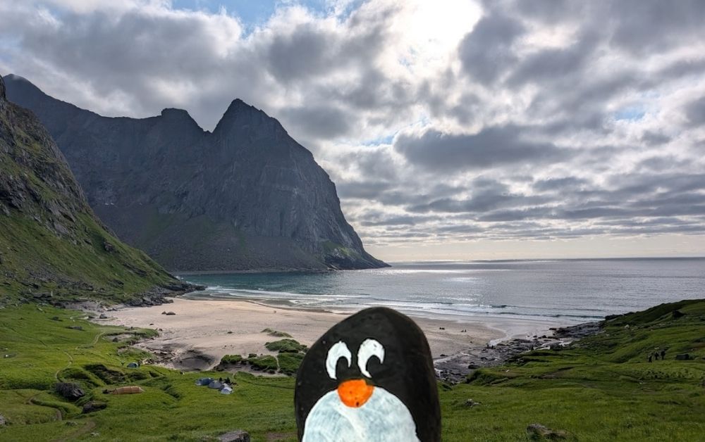 Hand-painted penguin stone #364 hidden at Kvalvika Beach, Moskenes, Norway (photo 1 of 5)