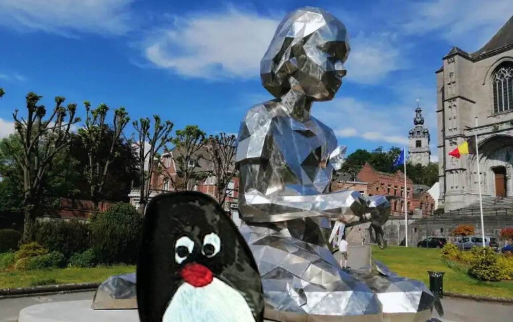 Hand-painted penguin stone #588 hidden at Lucy and the Butterflies, Mons, Belgium (photo 1 of 5)