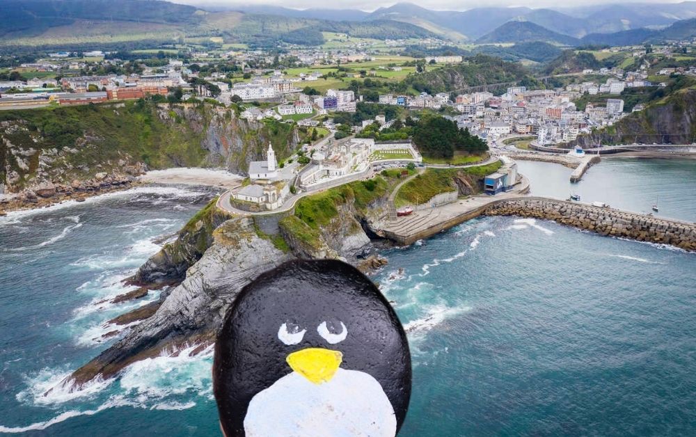 Hand-painted penguin stone #60 hidden at Faro de Luarca, Luarca, Spain (photo 1 of 5)