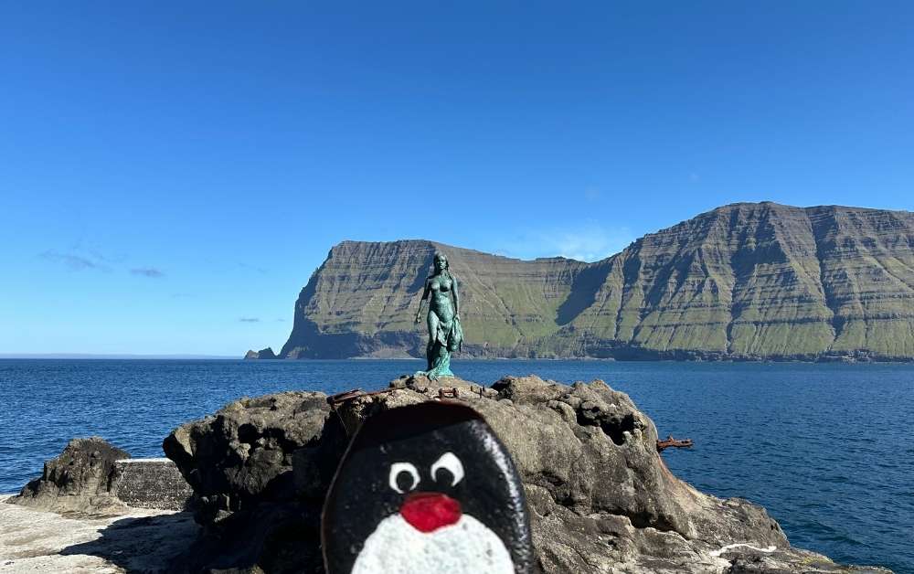Hand-painted penguin stone #412 hidden at The Seal Woman, Mikladalur, Faroe Islands (photo 1 of 5)