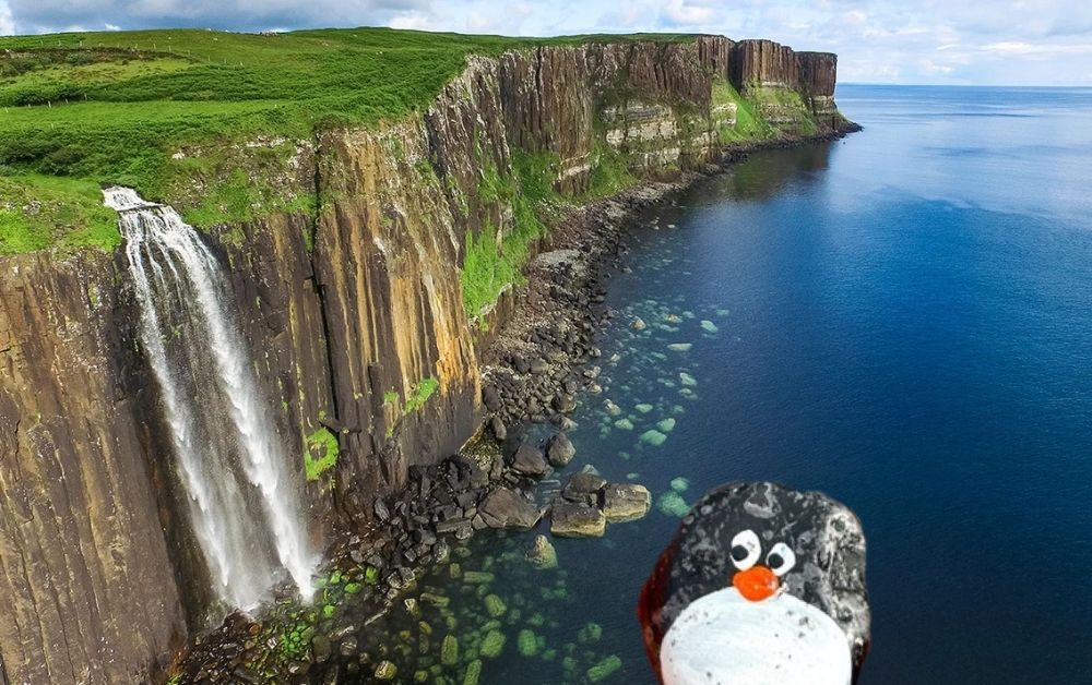 Hand-painted penguin stone #520 hidden at Kilt Rock Waterfall, Elishader, United Kingdom (photo 1 of 5)
